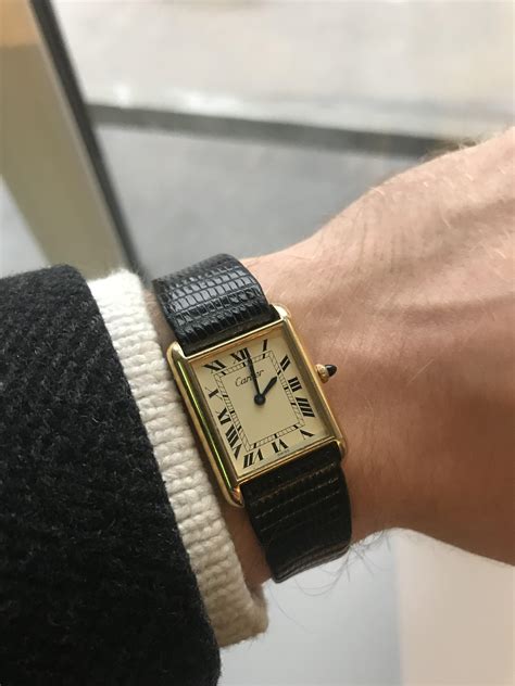 vintage cartier tank on wrist.